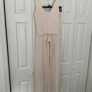 A soft creamy buttery color knit pants and top
